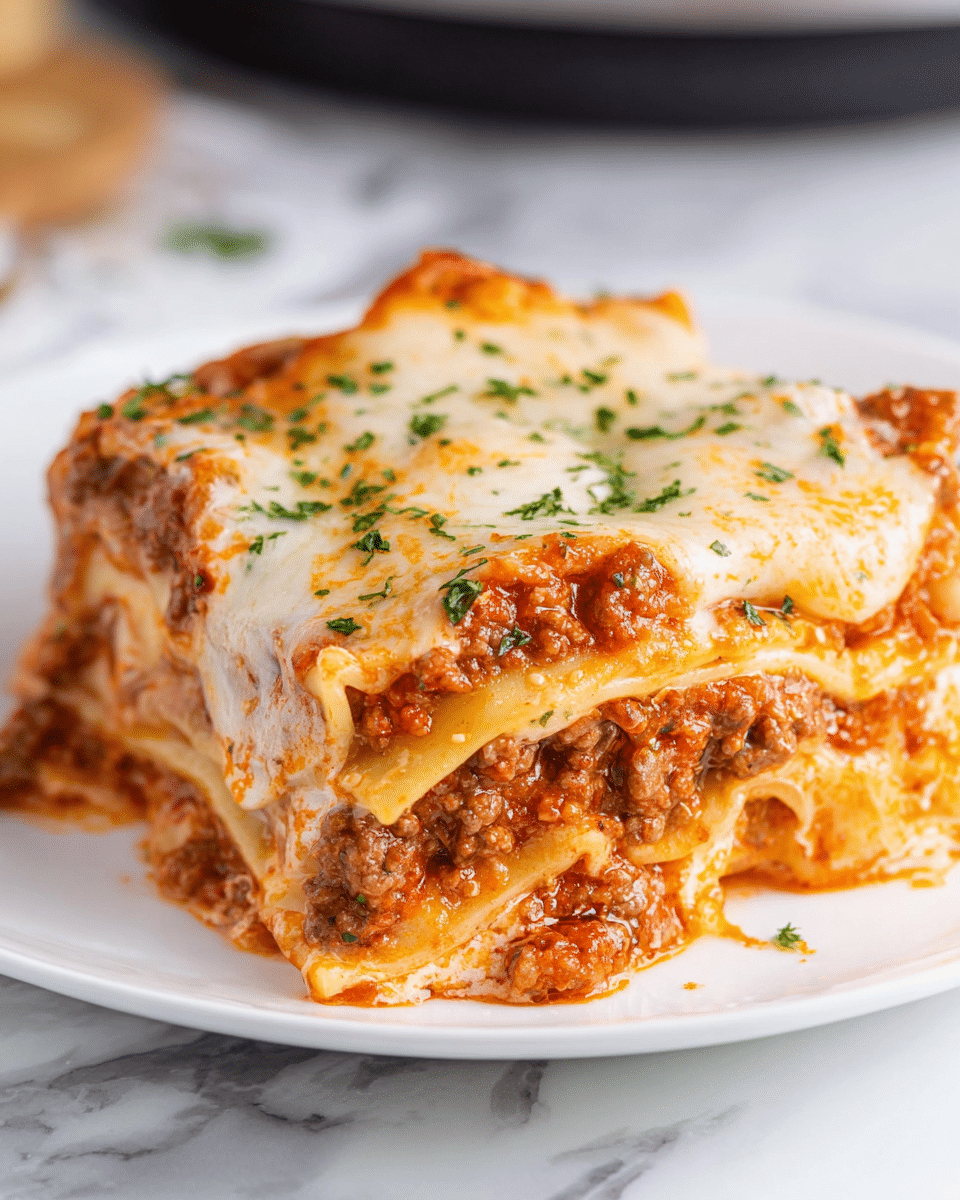 A close-up of two thick square slices of lasagna on a white plate, each slice showing multiple layers starting with reddish-orange tomato meat sauce mixed with ground beef at the bottom, followed by a creamy white cheese layer, then a flat pale yellow pasta sheet, and more tomato meat sauce with melted light golden-brown cheese on top, sprinkled with small green herb pieces. The lasagna edges look soft and the cheese slightly browned in spots, creating a rich, gooey texture. The background has a white marbled surface with blurred objects, focusing fully on the lasagna. photo taken with an iphone --ar 4:5 --v 7