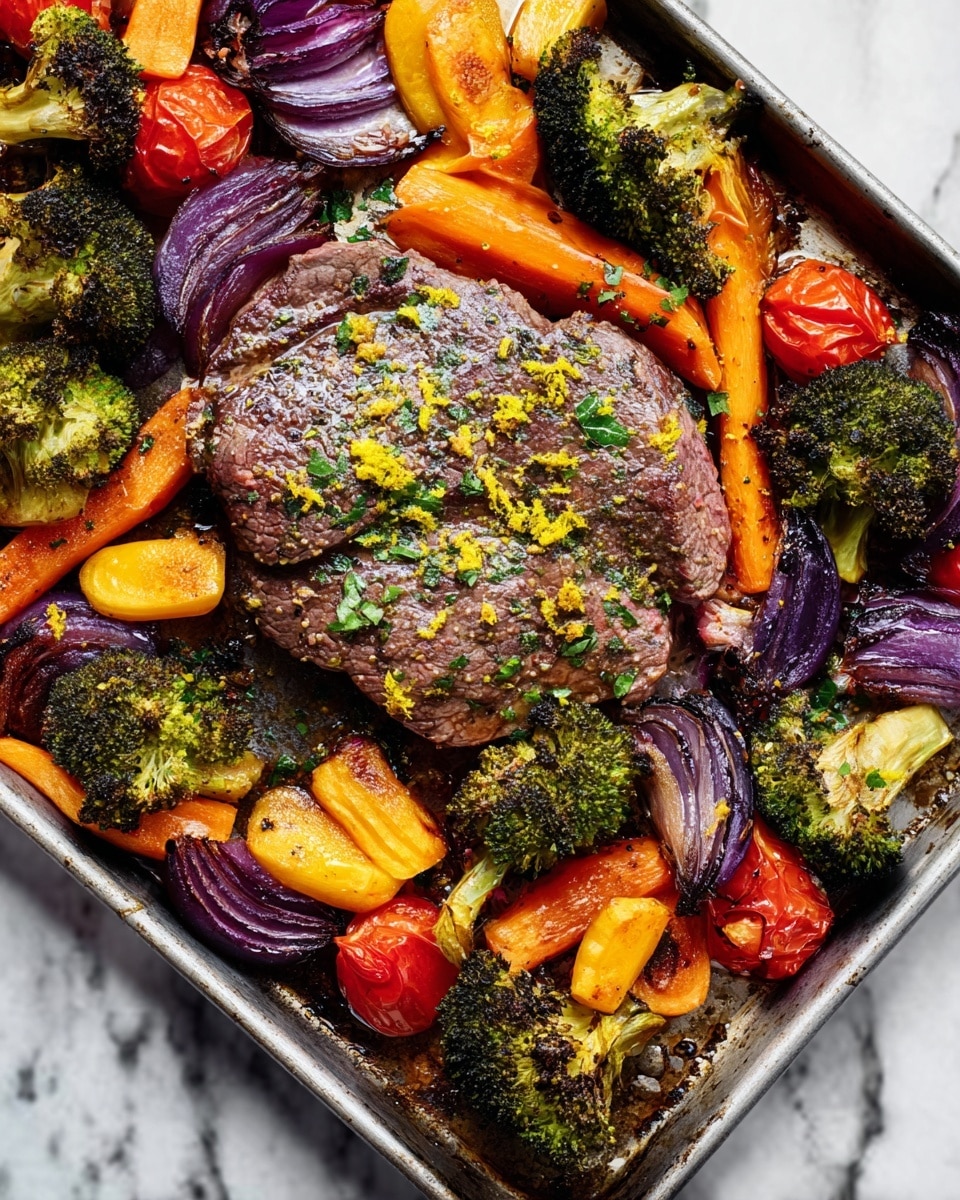 A cooked piece of steak lies in the center of a metal tray, sprinkled with small green herb flakes and yellow zest. Surrounding the steak are bright roasted vegetables: dark green broccoli florets, orange carrot slices, bright red charred cherry tomatoes, and purple onion chunks with a slightly burnt texture. The tray shows signs of roasting with caramelized edges on the vegetables, all set against a white marbled surface. Photo taken with an iphone --ar 4:5 --v 7
