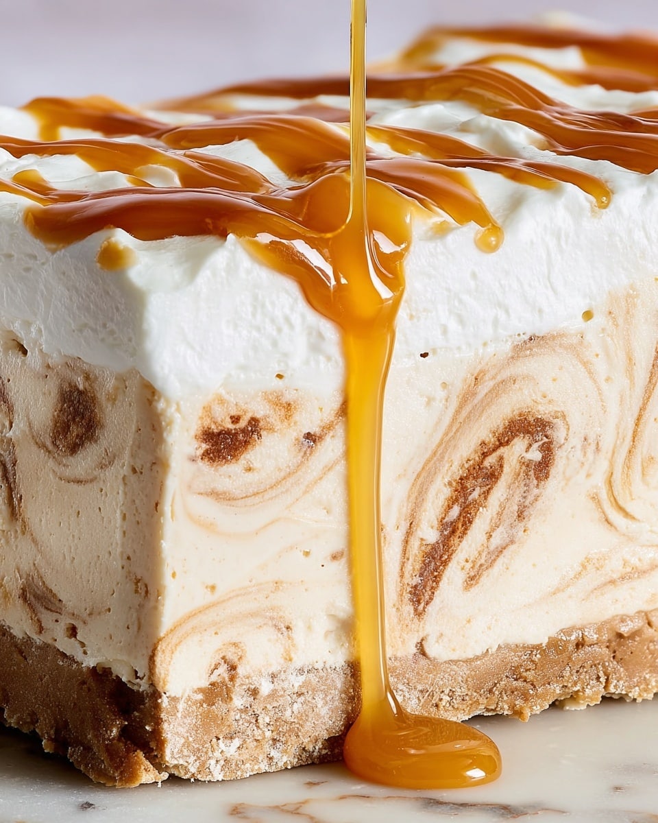 A close-up cross-section of a creamy dessert shows three distinct layers. The bottom layer is a thick, smooth cream base with a pale beige color. The middle layer has swirls of light brown with specks, giving a marbled effect mixed into the cream. The top layer is a soft, fluffy white cream. A golden caramel sauce is being poured over the top, forming shiny, thick ribbons and drops that cascade down the sides of the dessert. The dessert sits on a white marbled surface. Photo taken with an iphone --ar 4:5 --v 7