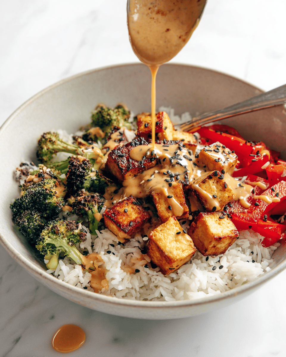 A white bowl filled with a base layer of white rice, topped with three sections: on the left, bright green broccoli florets slightly charred and covered with sauce; in the middle, golden-brown tofu cubes coated in a creamy orange sauce sprinkled with black sesame seeds; and on the right, roasted red bell pepper strips with some charred edges. A silver spoon rests inside the bowl, held by a woman's hand wearing a gray knitted sleeve. The background is a white marbled texture. Photo taken with an iphone --ar 4:5 --v 7